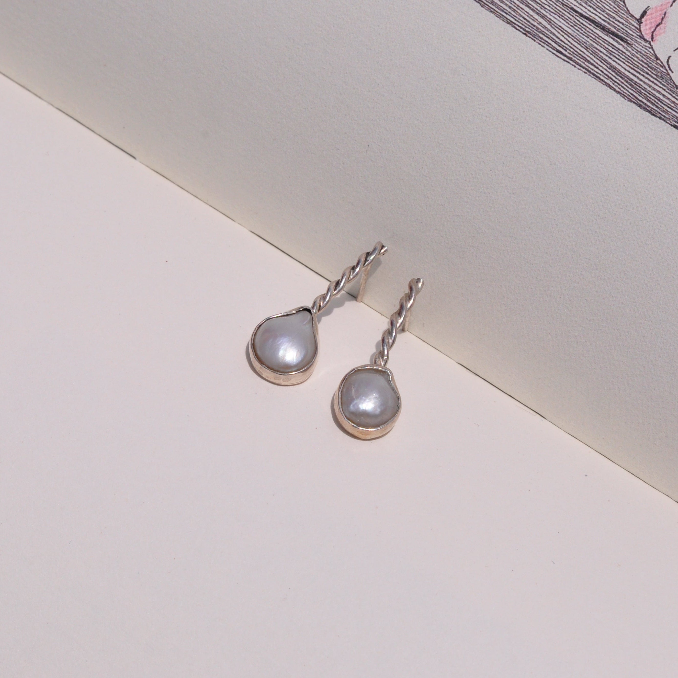 Aretes perla